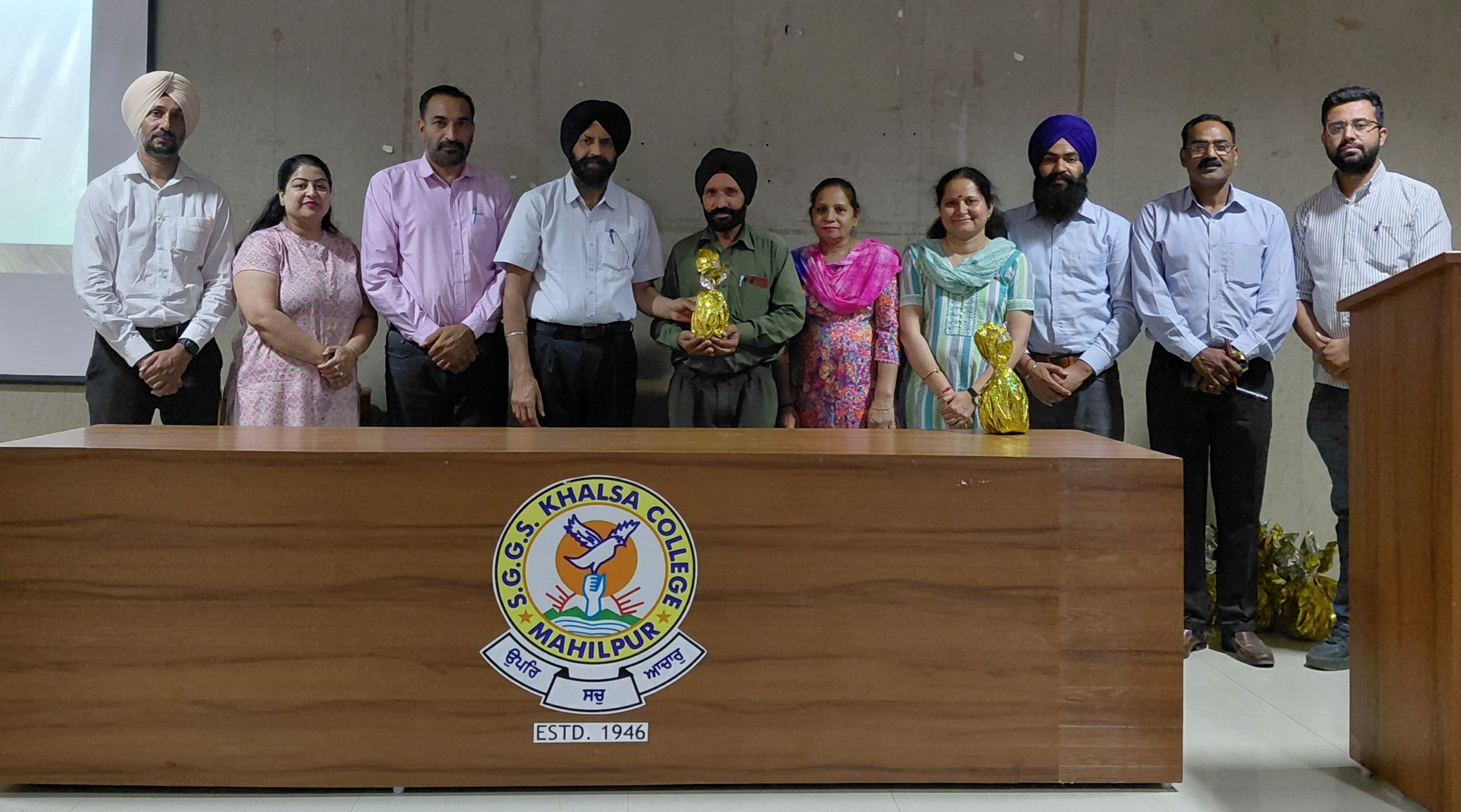 Khalsa College Mahilpur honoured grade four employees on Labour Day.